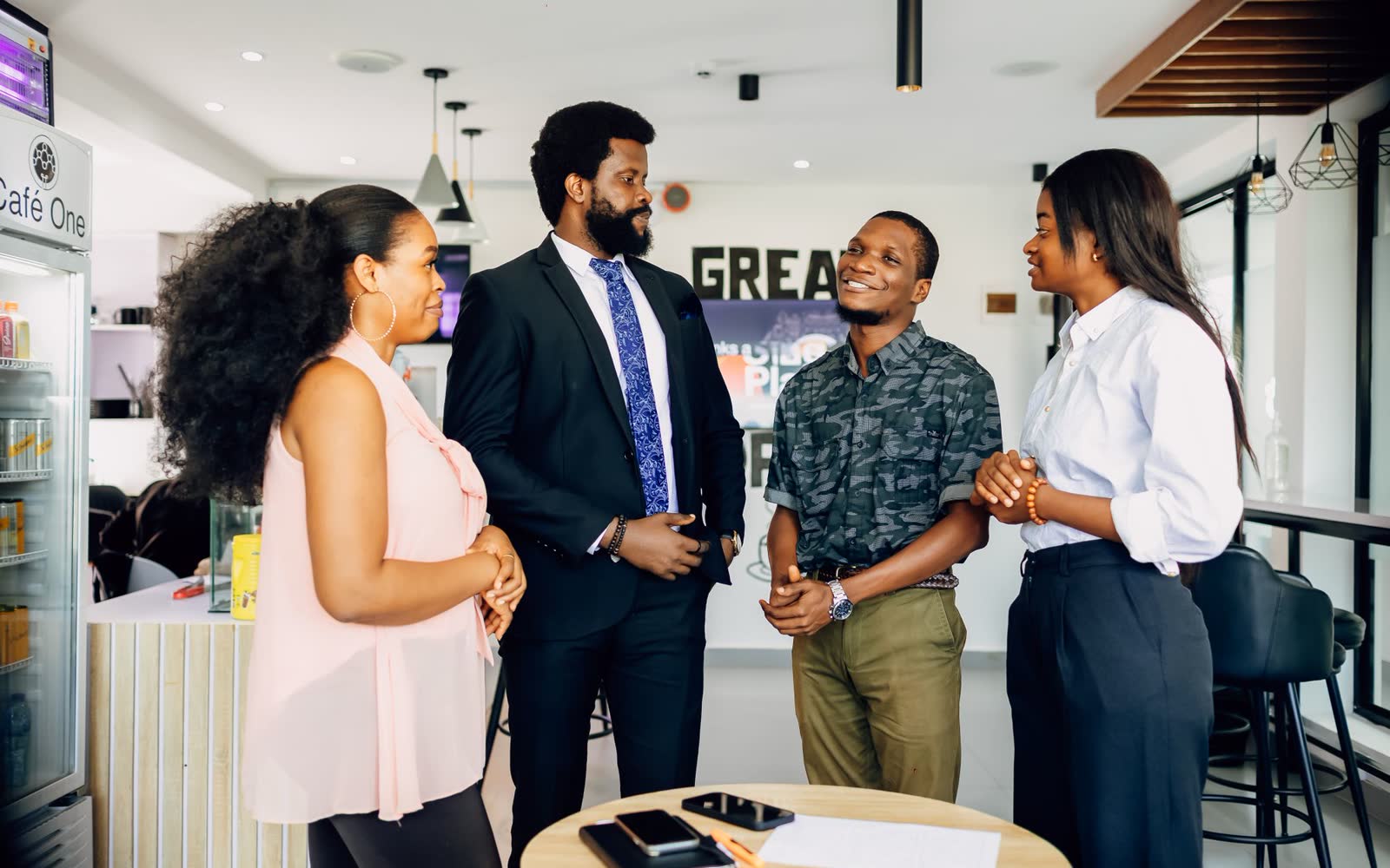 Colleagues in conversation in an office